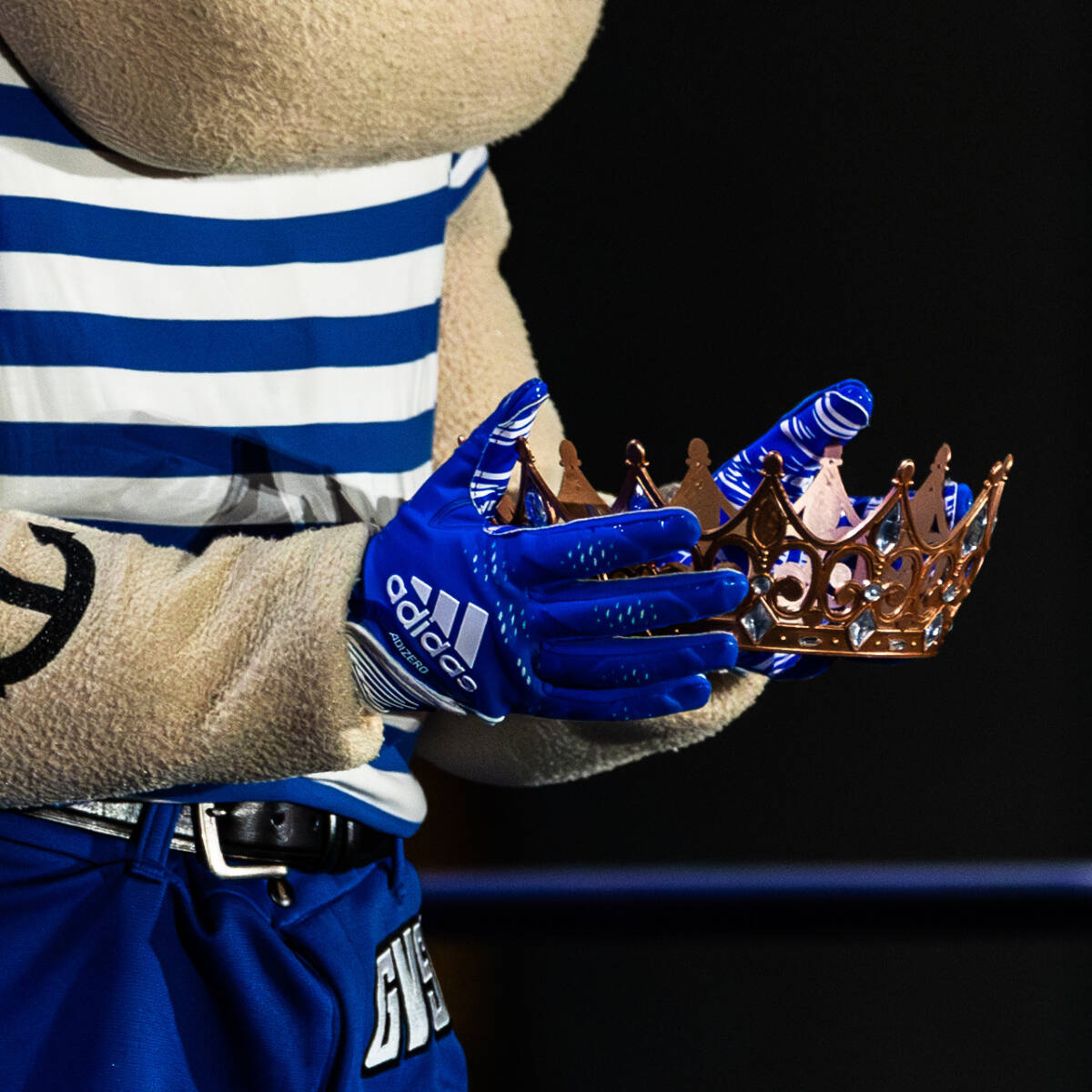 Louie the Laker holding a gold crown